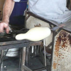 The lights are hand-shaped using various tools to prep it for the mold.