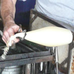 The lights are hand-shaped using various tools to prep it for the mold.