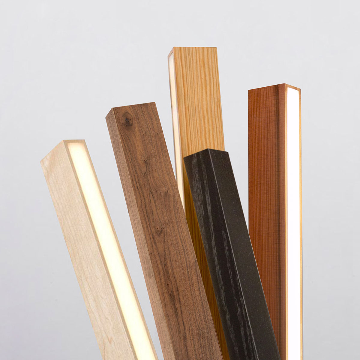 Stickbulb's five material options: maple, walnut, reclaimed heart pine, ebonized oak and reclaimed water tower redwood.